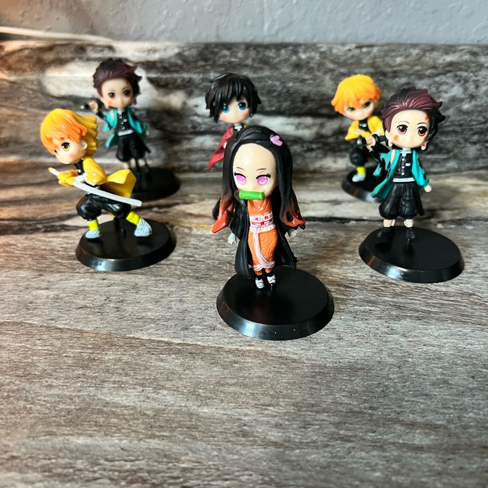 6 anime figures with removable stands…. New without tags